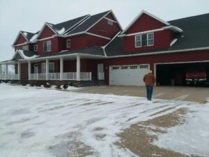 a large house with an attached 4 stall garage that was moved